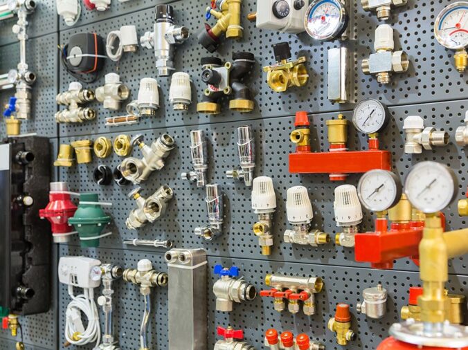 Bras and stailess plumbing fittings ona wall