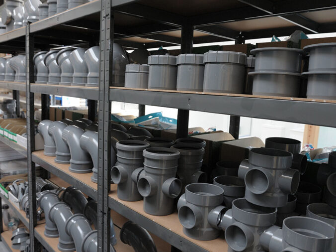PVC elbows and fittings in a plumbing supply warehouse